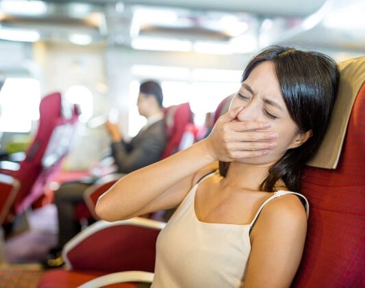 Image-of-a-Woman-feeling-sick-during-travel Image of a Woman feeling sick during travel